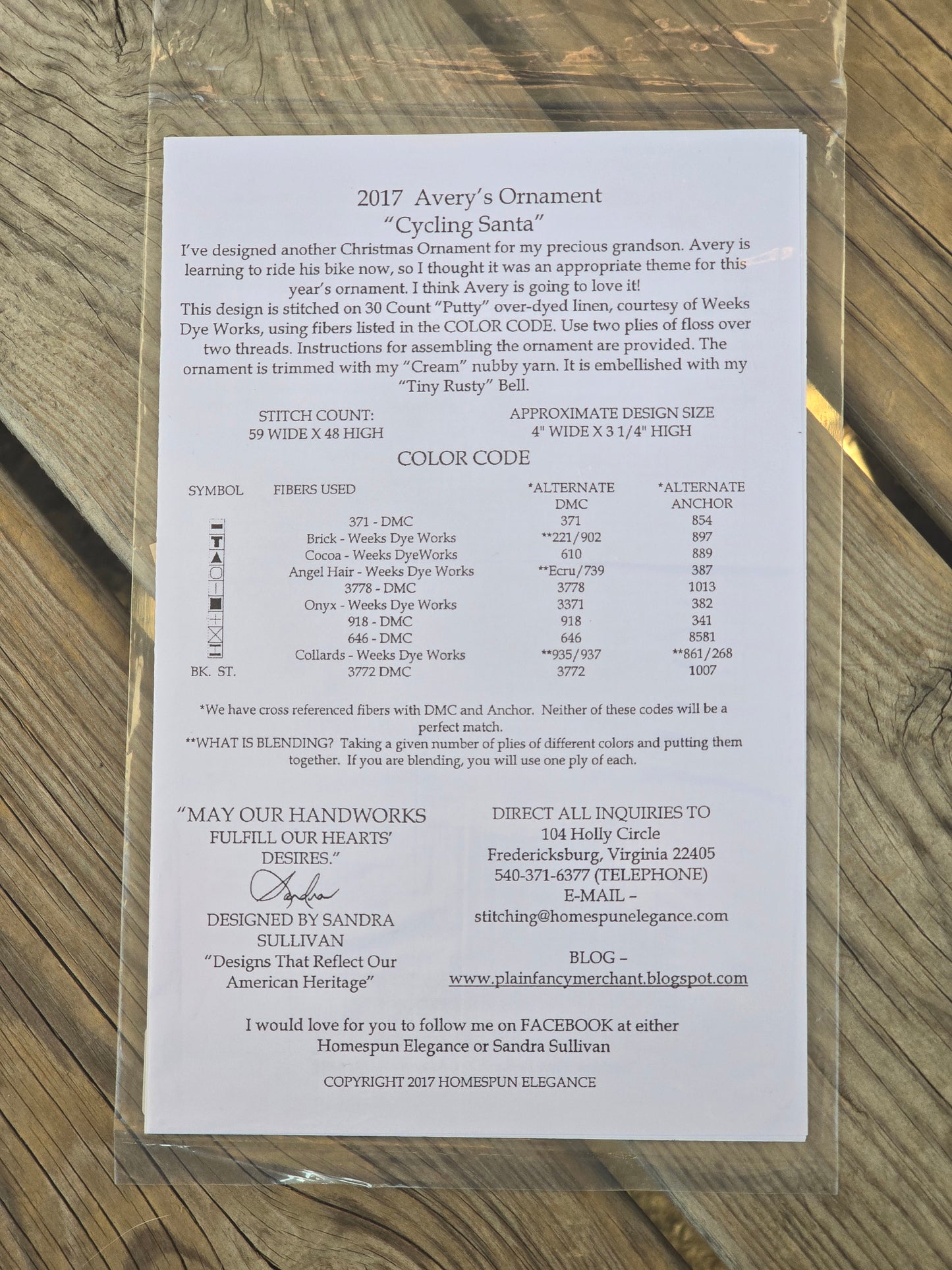 Homespun Elegance - Merry Noel Collection - Avery's Cycling Santa - Cross Stitch Pattern