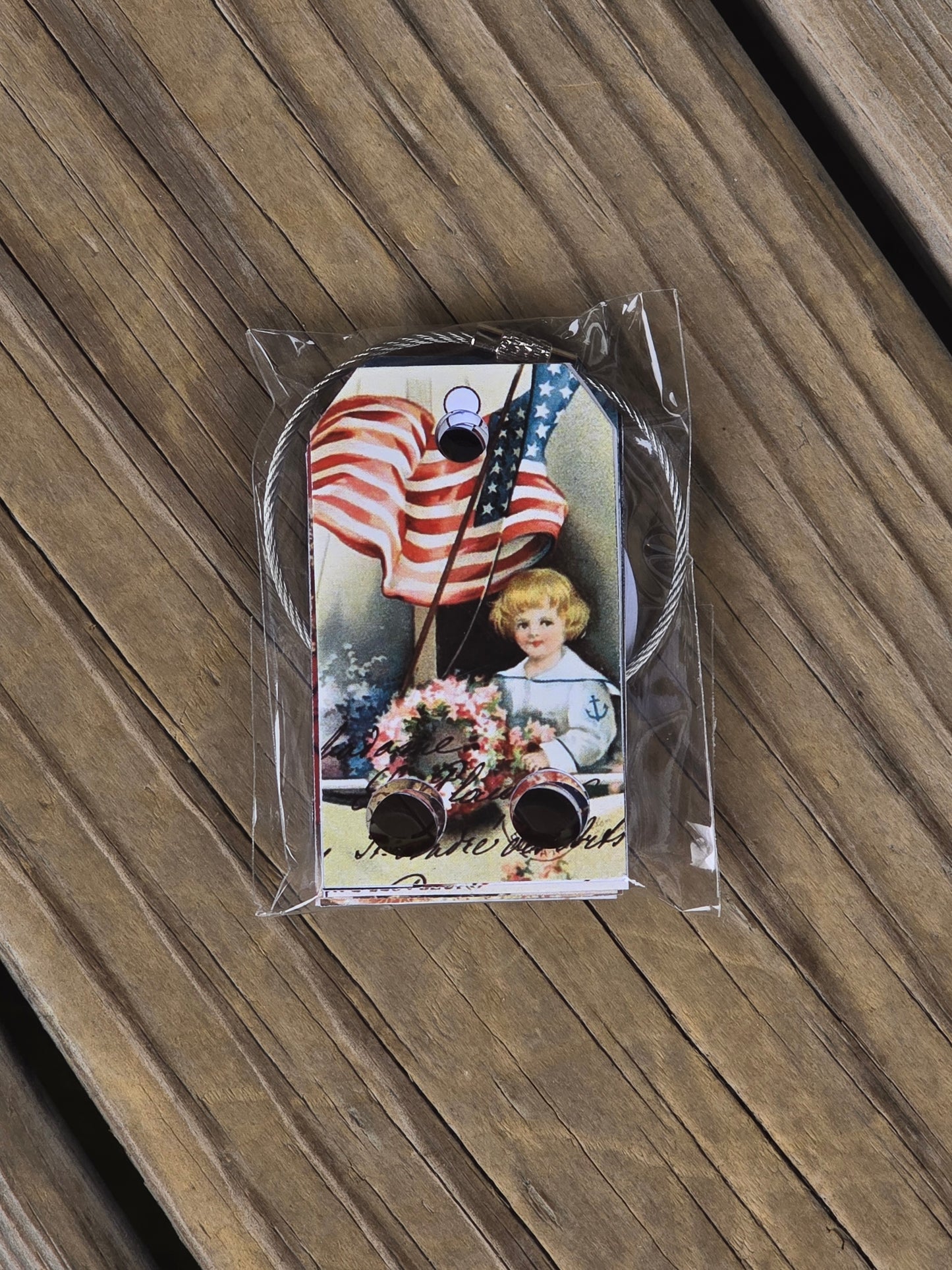 The Cottage Cat Designs - Girl with Flag and Other Patriotic Floss Drops - Nashville Needlework Market 2026