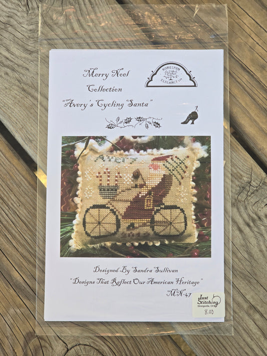 Homespun Elegance - Merry Noel Collection - Avery's Cycling Santa - Cross Stitch Pattern